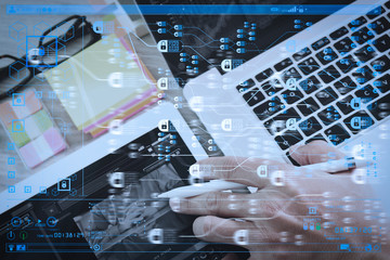 businessman working with digital tablet computer and smart phone and laptop computer with digital business strategy layer effect on wooden desk as concept