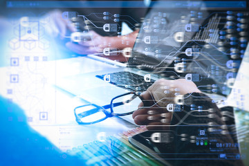 two colleagues website designer discussing data and digital tablet and computer laptop with graphics design diagram on marble desk as concept, sun flare effect