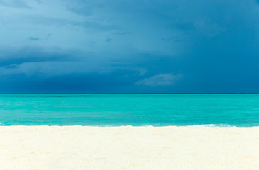tropical Maldives island with white sandy beach and sea