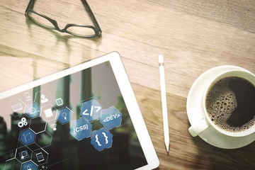 Coffee cup and Digital table dock smart keyboard,eyeglasses,stylus pen on wooden table,filter effect