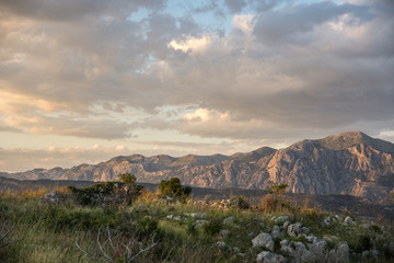 Sunset lights over the sea and mountains