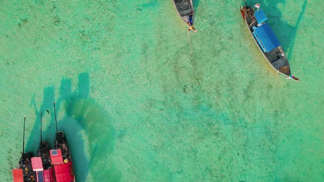 Flying above longtail boats on Laem Tong, Part Of Phi Phi Island. 
