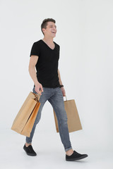 Handsome man in a black T-shirt with a bag