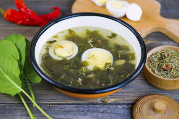 green sorrel soup with egg and spices