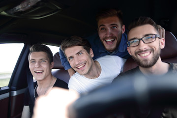 Close up side portrait of happy man driving car