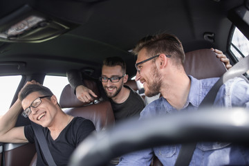 four friends traveling in the car