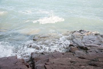 wave and drops at the beach