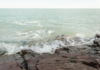wave and drops at the beach