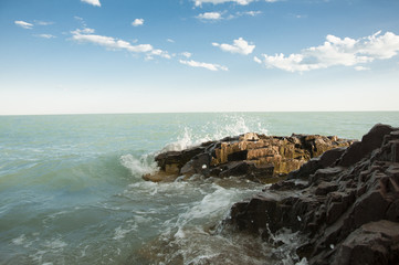 Wave crashing on the rocky reef