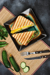 Top view of Sandwich toast with lettuce, ham, egg