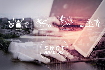 close up of businessman hand working with laptop and digital docking keyboard tablet computer in...