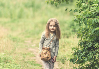 cute little girl is walking in summer
