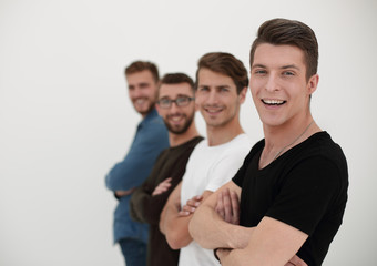 A group of people with arms crossed stands in a row