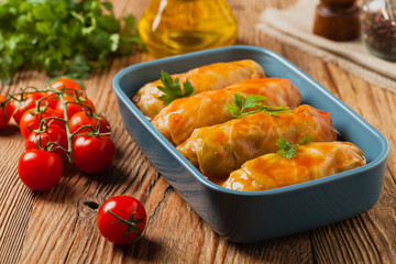 Traditional stuffed cabbage with minced meat and rice, served in a tomato sauce.