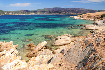 Fototapeta na wymiar Seascape with clear turquoise water and rocks at foreground, Pena island, Chalkidiki, Greece