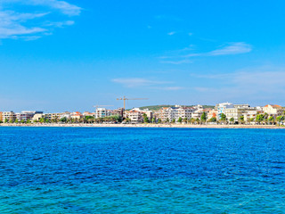 Panorama of the sea and the city of Alghero in the background. Sardinia, Italy.