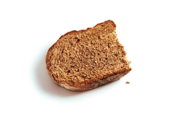 A piece of handmade freshly baked rye bread, isolated on white background.