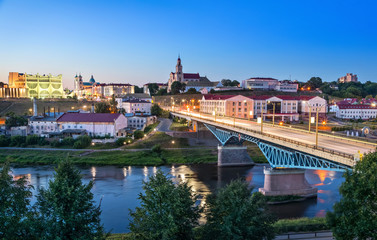 Cityscape of Grodno at dusk with bridge over Neman river, Belarus - obrazy, fototapety, plakaty