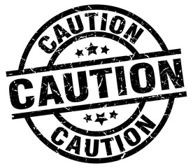caution round grunge black stamp