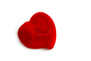 A red jewelry box in a shape of heart, isolated on white background. Expensive gift concept, marriage preposition.