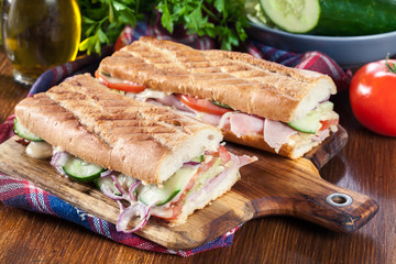 Toasted sandwiches with ham, cheese and vegetables