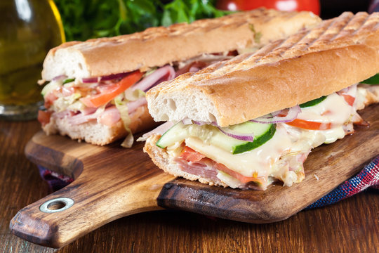 Toasted sandwiches with ham, cheese and vegetables
