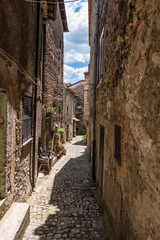 Ancient worn walls of a medieval town alley.