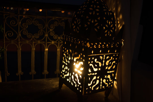 oriental lantern with candle in the night