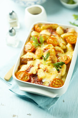 Homemade pasta bake with cheese and tomatoes