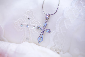 Christian cross to wear on the body after baptism.