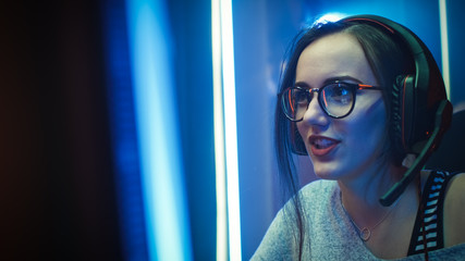 Close-up Portrait of the Beautiful Professional Gamer Girl Playing in Online Video Game, Casual...