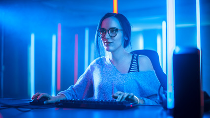Beautiful Professional Gamer Girl Playing and Streaming Online Video Game on Her Personal Computer....