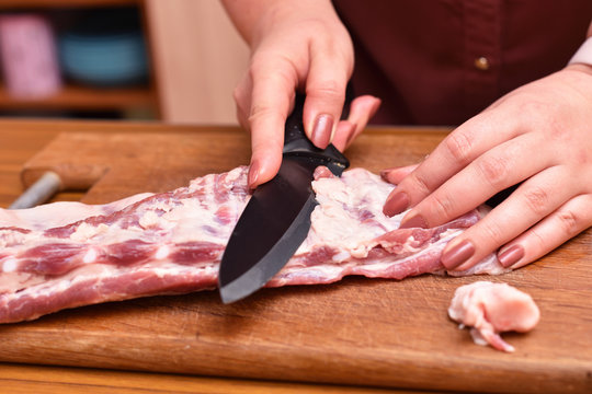 Trim excess fat from pork meat on the ribs. To remove unwanted fat on the meat
