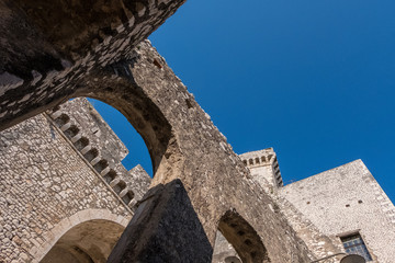 Fototapeta na wymiar Stone castle architecture with blue sky background.