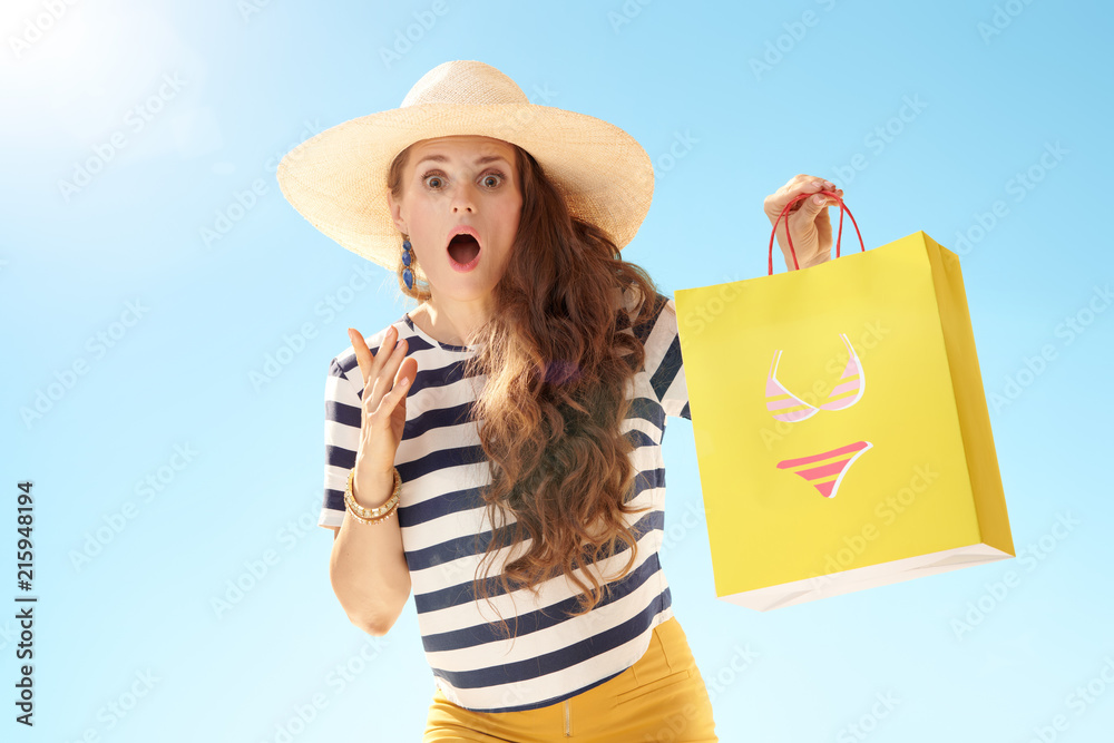 Sticker woman against blue sky with yellow shopping bag with bikini