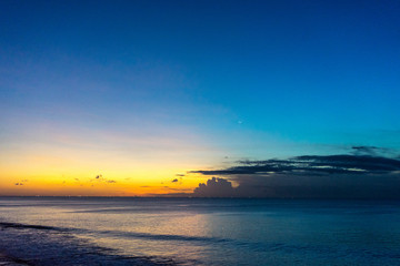 Tropical sunset on the beach of Jimbaran in Bali Indonesia