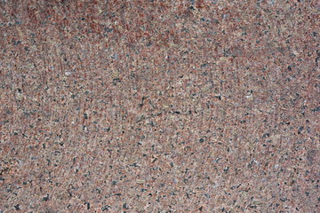 Pattern of red artificial marble tabletop for background. On surface of traces of cutter for cutting stone