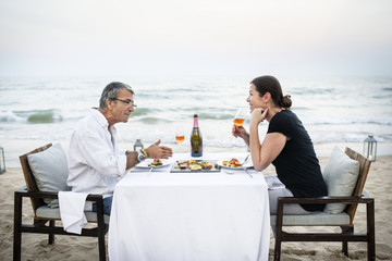 Young couple in a wedding ceremony at the beach