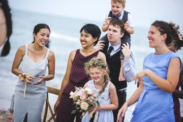 Wedding guests clapping for the bride and groom