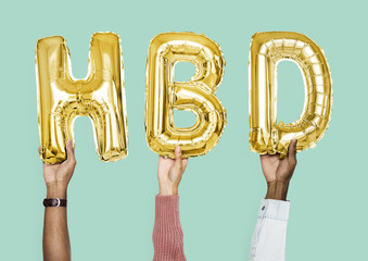 Yellow gold alphabet balloons forming the word HBD