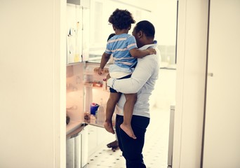 Fototapeta na wymiar Black father enjoy precious time with his child together happiness