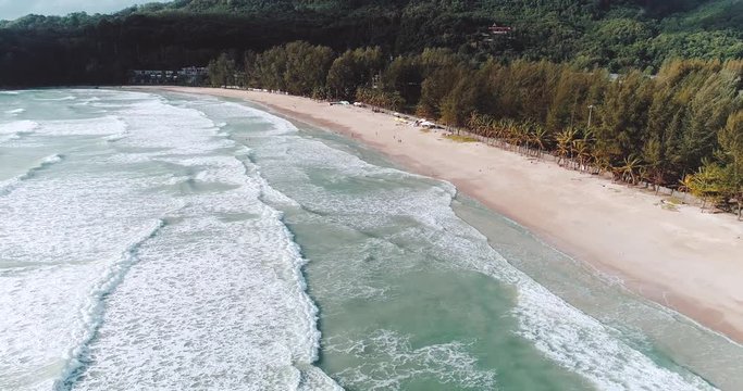 Aerial drone view of sea waves of the tropical island coastline