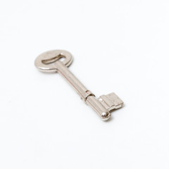 Key isolated on white background. Studio lighting.