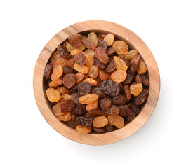 Top view of wooden bowl full of raisins