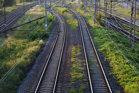 Railway rails leaving for the horizon