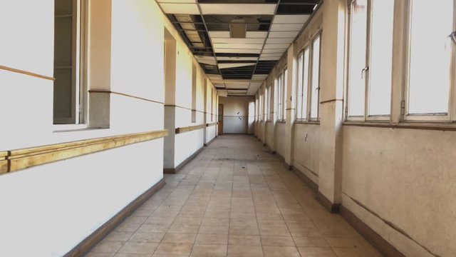 walk through abandoned and deteriorated asylum corridor