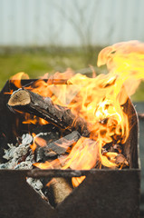 burning brazier with firewood/burning brazier with firewood, selective focus