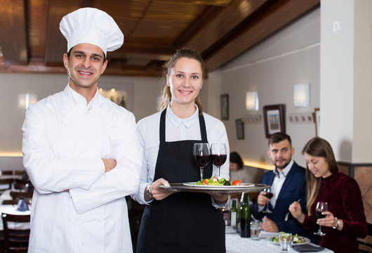 Portrait of chef and waitress