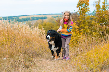 girl running with big dog