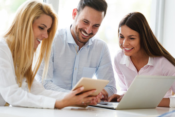 Happy colleagues casual chat at the office